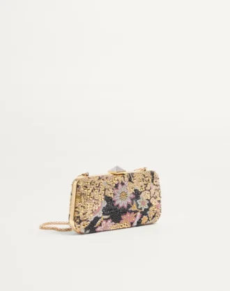 Carry Secrets Minaudiere mit Strasssteinen und Apres L’Hiver-Motiv